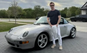 Marshall stands next to his car and home, a giant who shows us the steps, mindset and strategies for seizing opportunities and quickly turning them to success.